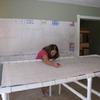 Tawnie working on the outlining on her first silk flag